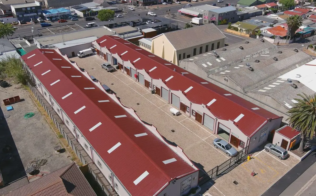 Aerial view of an industrial park with red roofs